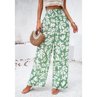 Comfortable women's fashion pants with vibrant tropical print, perfect for summer and casual wear.