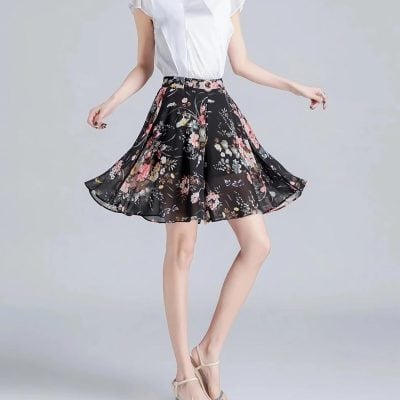 Elegant floral midi skirt for women, perfect for casual and formal occasions, showing vibrant flower patterns on black, made from lightweight, flowy fabric.