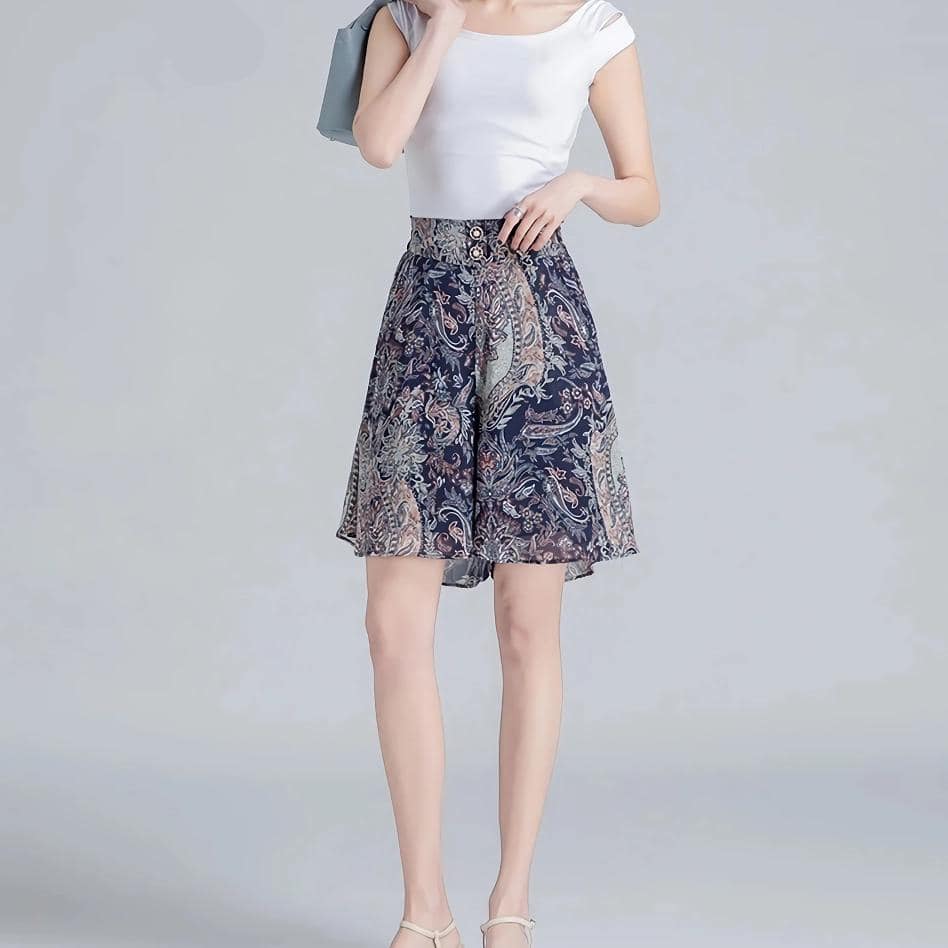 Photo of a fashionable woman wearing a stylish, patterned knee-length skirt, perfect for summer wear and casual stylish looks.