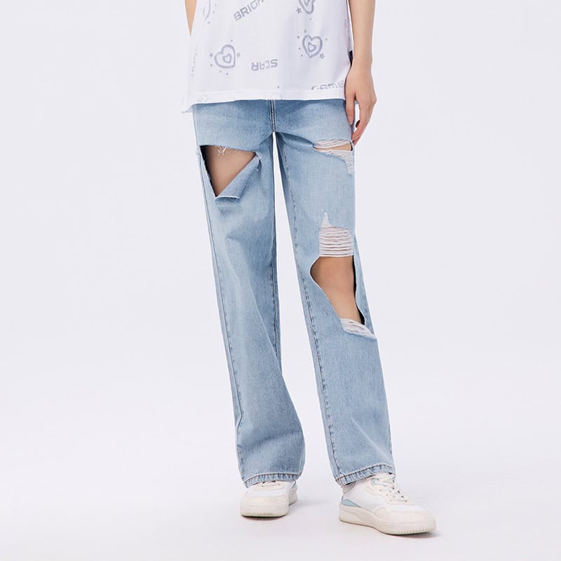 Comfortable trendy ripped denim jeans for women, stylish distressed design, perfect for casual wear and street style fashion.