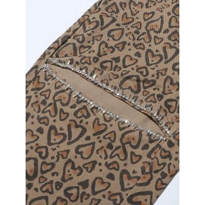 Stylish leopard print face mask featuring rhinestone accents, perfect for fashion-conscious individuals seeking trendy protective accessories.