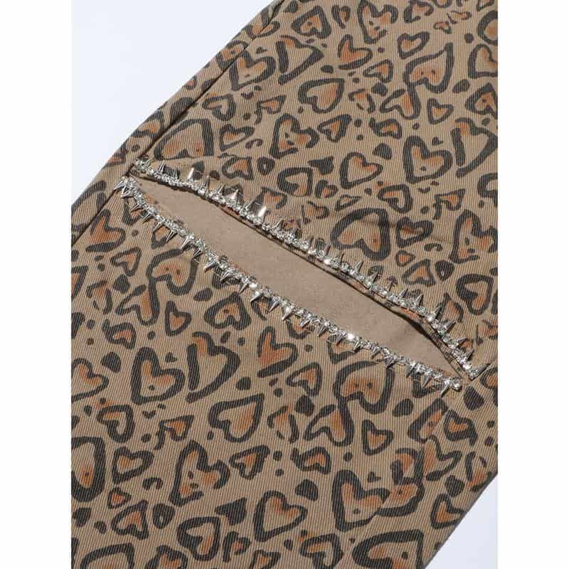 Stylish leopard print face mask featuring rhinestone accents, perfect for fashion-conscious individuals seeking trendy protective accessories.