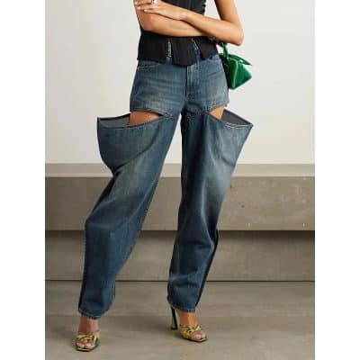 Stylish distressed jeans with unique cut-out detailing for a modern and edgy look, perfect for fashion-forward individuals seeking trendy opt styles.