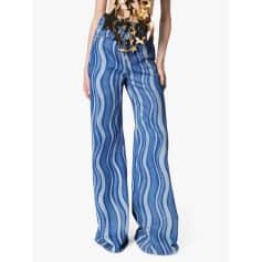 High-waisted wide-leg jeans with blue and white wavy stripe pattern, comfortable fit, stylish for casual and fashion-forward outfits.