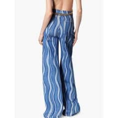 Stylish wide-leg jeans with blue and white stripes, featuring a chain belt for a chic look. Perfect for casual, summer, or beachwear. High-quality denim offers comfort and durability, ideal for fashion-forward outfits.
