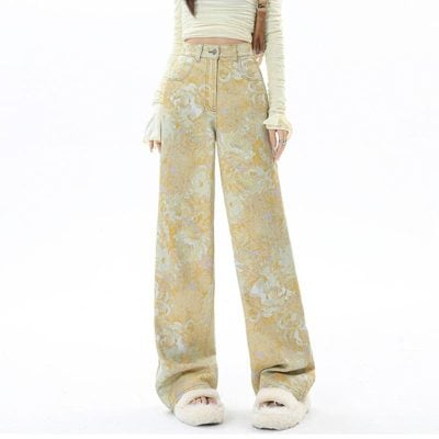 Elegant high-waisted wide-leg pants with a gold floral pattern, perfect for fashion-forward outfits and casual wear. Made from comfortable fabric, ideal for trendy, versatile styling.