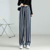 Comfortable wide-leg striped pants for women, perfect for casual or stylish occasions. Made from high-quality fabric, these trendy pants offer style and comfort, ideal for everyday wear.