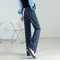 Comfortable wide-leg denim pants with moon print for stylish casual wear. Perfect for fashion-forward individuals seeking trendy, comfortable jeans.