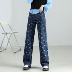 Comfortable wide-leg denim pants with moon print, perfect for everyday fashion and stylish eyewear storage.