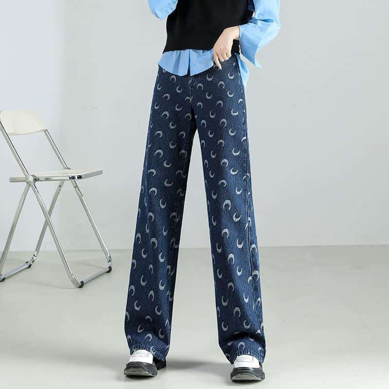 Comfortable wide-leg denim pants with moon print, perfect for everyday fashion and stylish eyewear storage.