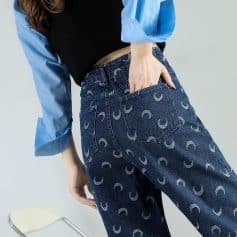 Stylish high-waisted jeans with moon pattern, perfect for fashion-forward looks. Great for casual or trendy outfits, offering comfort and unique design.