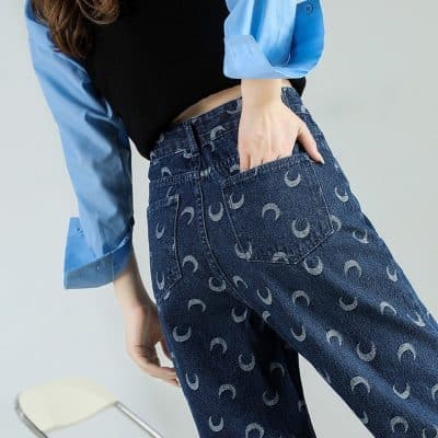 Stylish high-waisted jeans with moon pattern, perfect for fashion-forward looks. Great for casual or trendy outfits, offering comfort and unique design.