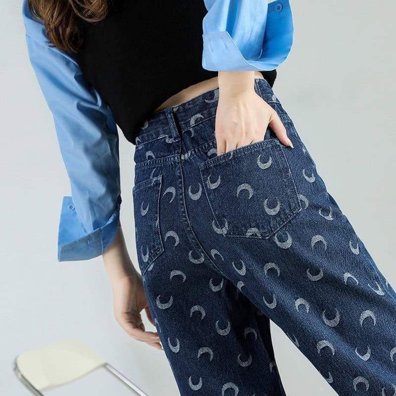 Stylish high-waisted jeans with moon pattern, perfect for fashion-forward looks. Great for casual or trendy outfits, offering comfort and unique design.