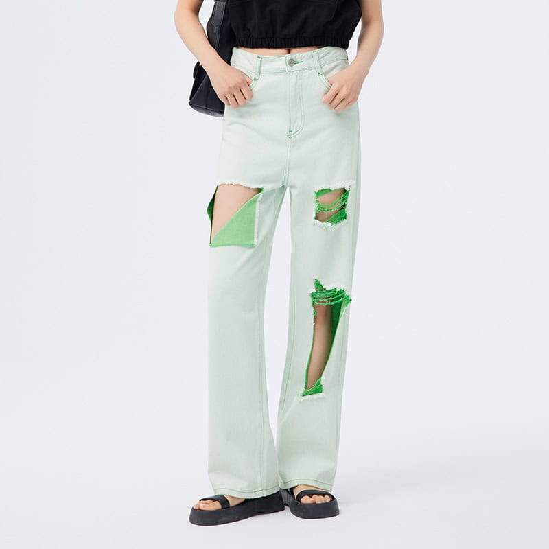 Casual white ripped jeans with green accents, oversized fit, distressed style, perfect for trendy streetwear, comfortable, and stylish for everyday wear.