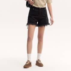 Stylish black distressed denim shorts perfect for everyday wear, combining comfort and trendy design with frayed hems.