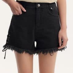 Stylish black denim shorts with frayed hem and lace-up side accents, perfect for casual summer looks. Made from high-quality denim, these shorts offer comfort and trendy style for women.