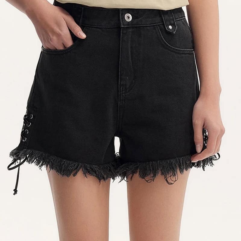 Stylish black denim shorts with frayed hem and lace-up side accents, perfect for casual summer looks. Made from high-quality denim, these shorts offer comfort and trendy style for women.