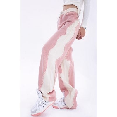 Comfortable wide-leg denim pants with distressed details, perfect for casual and trendy looks. Suitable for fashion-forward women seeking unique, stylish apparel.