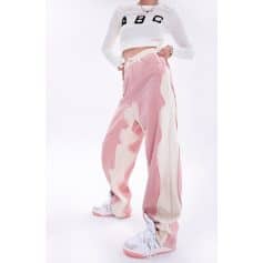 Stylish oversized pink and white distressed jeans with a relaxed fit, ideal for casual and streetwear fashion.