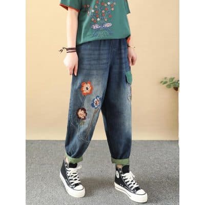 Fashionable embroidered floral distressed denim jeans for women, trendy casual streetwear. Perfect for stylish daily outfits.