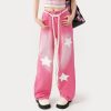 Comfortable pink star-printed wide-leg jeans with a white rope belt, perfect for trendy fashion statements.