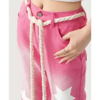 Stylish pink denim shorts with a casual fit, featuring a rope belt detail. Perfect for summer wear and street fashion.