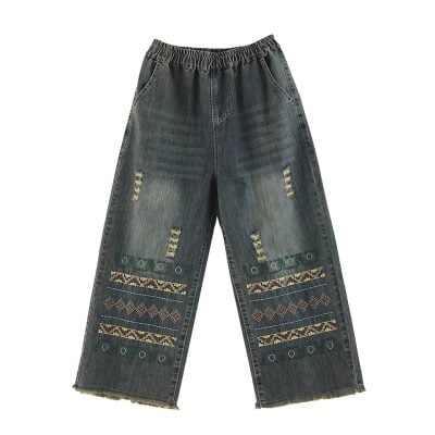 Casual distressed denim pants with colorful embroidery, ripped details, and a loose fit, perfect for trendy, comfortable style and streetwear fashion.