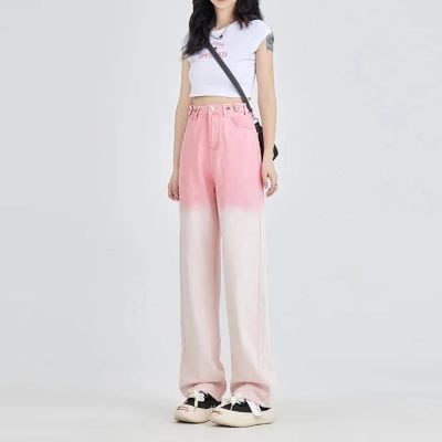 A young woman modeling trendy pink and white gradient wide-leg pants for modern fashion and casual wear. Perfect for stylish outings, emphasizing comfort and stylish appeal.
