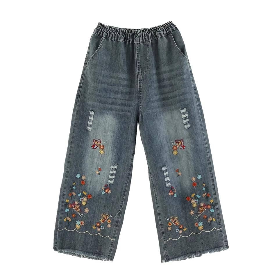 Casual denim pants featuring intricate embroidery, distressed details, and wide-leg fit, perfect for trendy, comfortable everyday wear. Great option for stylish and relaxed fashion.