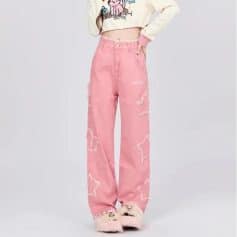 Stylish pink high-waisted distressed jeans with fun dog prints, perfect for casual wear and daytime outings. Made from comfortable denim material with trendy design details.
