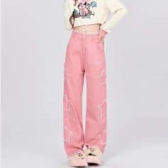 Comfortable pink ripped jean pants with wide-leg cut, stylish distressed details, and embroidery accents, ideal for casual fashion and streetwear looks.