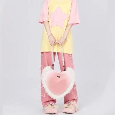 Stylish pink heart-shaped bag with fluffy white trim, ideal for fashion-forward accessories from Monalisa Store, complementing eyewear and apparel collection.