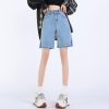 High-waisted denim shorts with frayed edges, perfect for casual and summer fashion, suitable for women looking for trendy, comfortable shorts.