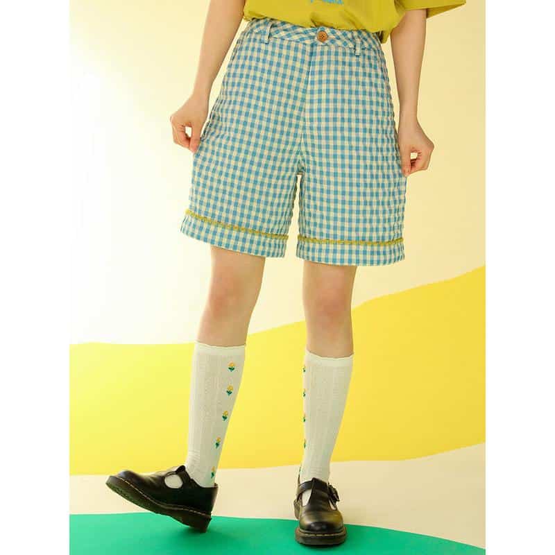 Casual gingham patterned shorts in blue and white, featuring rolled cuffs and side pockets, perfect for summer or casual outings.