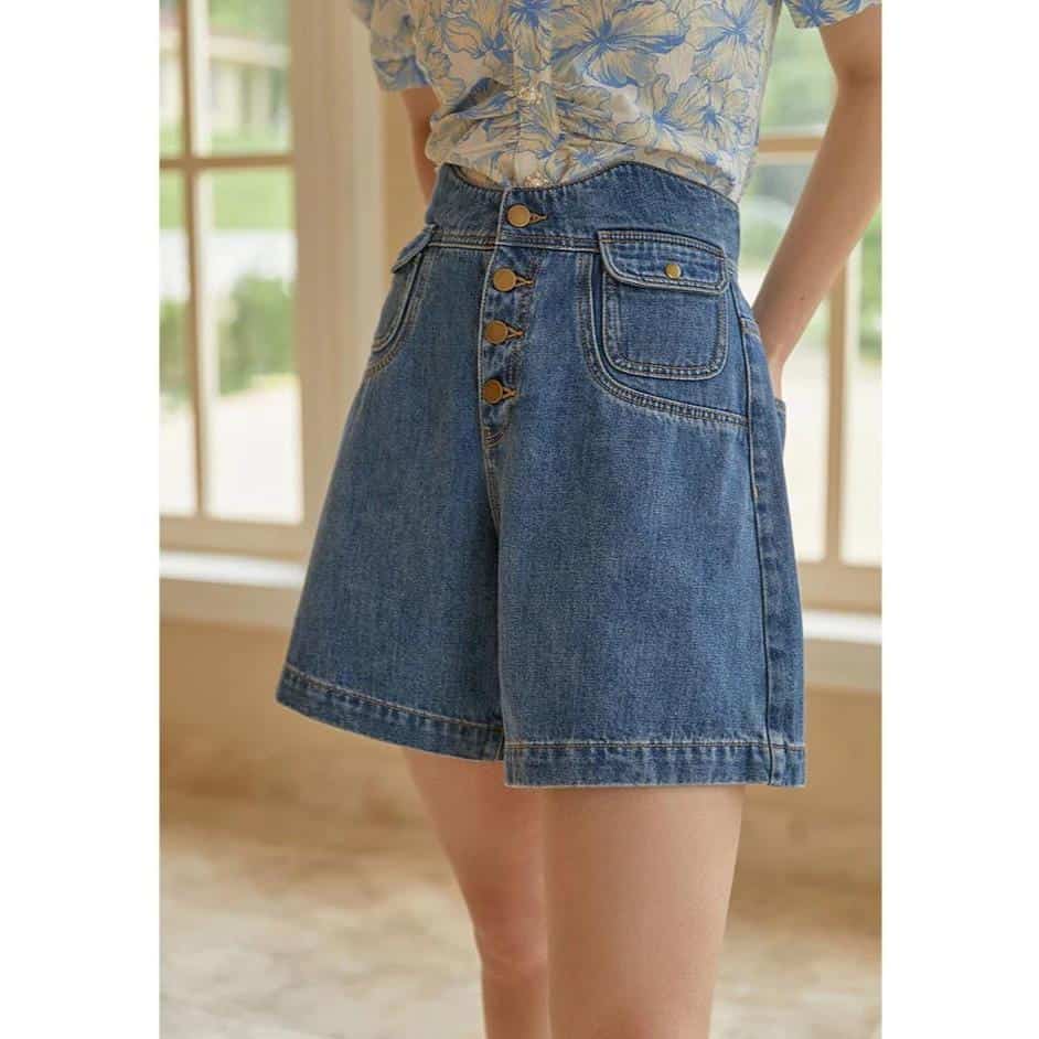 Comfortable high-waisted denim shorts with button closure and pocket details, perfect for casual summer outfits.