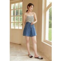 Stylish high-waisted denim shorts perfect for summer casual wear. Comfortable fit with button closure, ideal for women seeking fashionable and versatile wardrobe essentials.