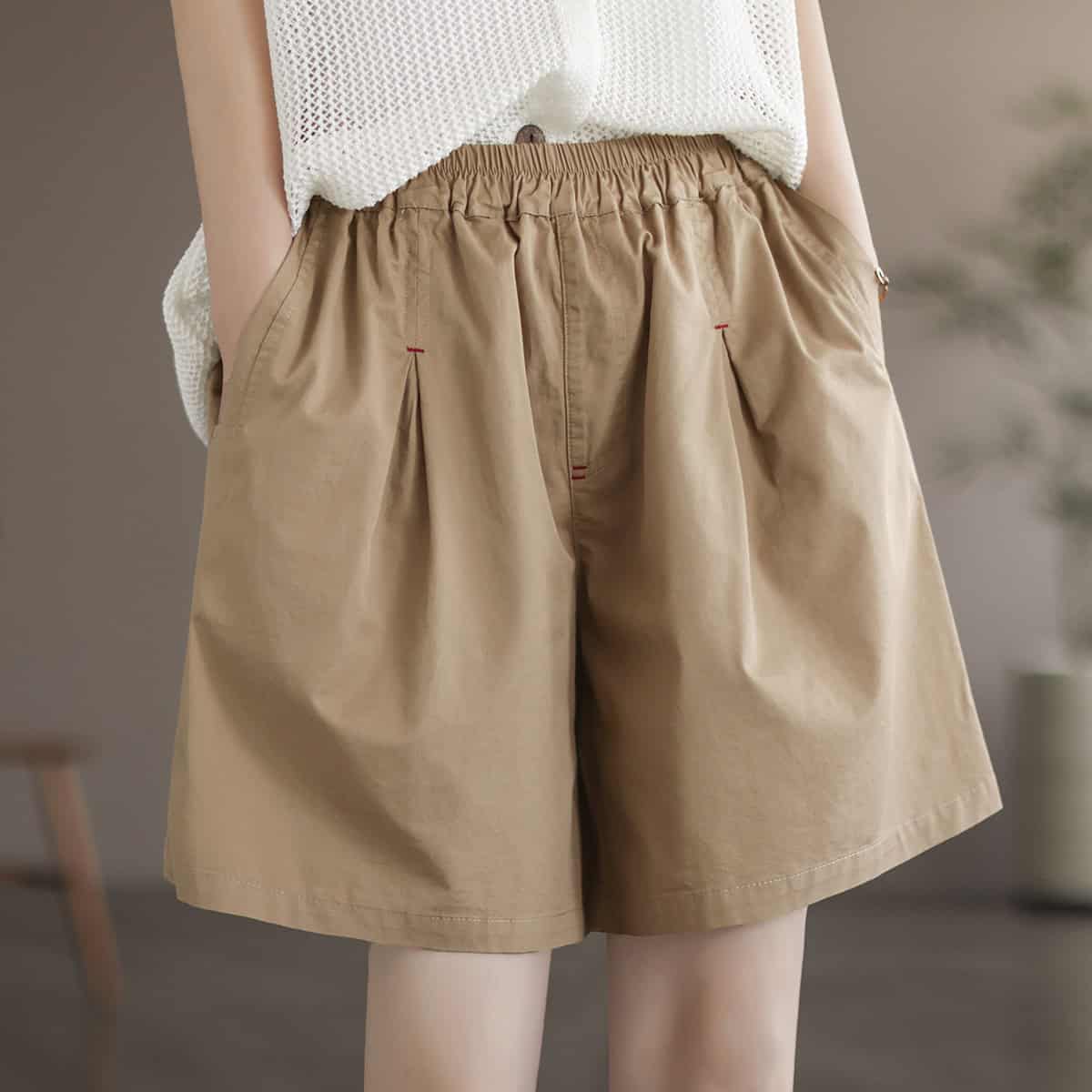 Comfortable beige women's casual shorts with elastic waistband, perfect for summer, travel, and everyday wear. Stylish and breathable, ideal for a fashionable yet comfortable look.