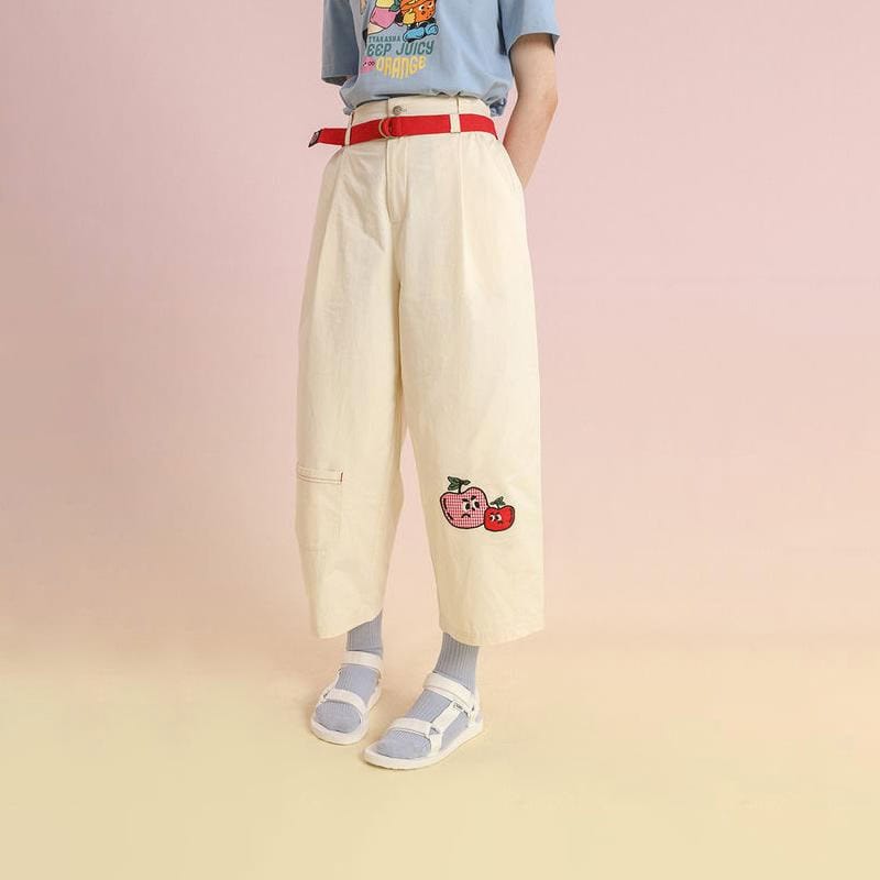 Bright yellow wide-leg pants featuring cute embroidered apple and strawberry patches, perfect for casual, trendy styles and comfortable wear.