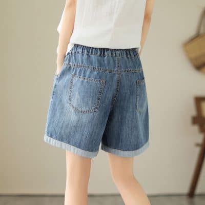 Comfortable denim shorts with elastic waistband, back pockets, perfect for casual wear and summer outfits.