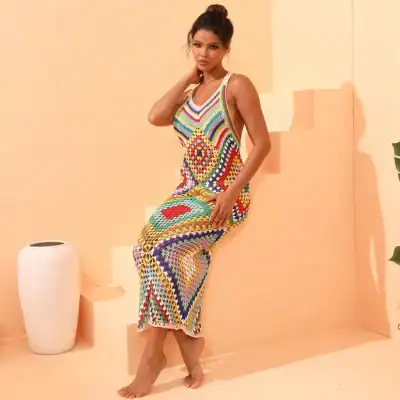 Vibrant hand-crocheted maxi dress featuring a patchwork of bright, multicolored patterns, perfect for summer and casual wear from Monalisa Store.