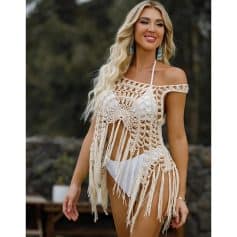 A stylish crochet beach cover-up perfect for summer vacations, featuring intricate patterns and fringe details for a trendy, bohemian look.