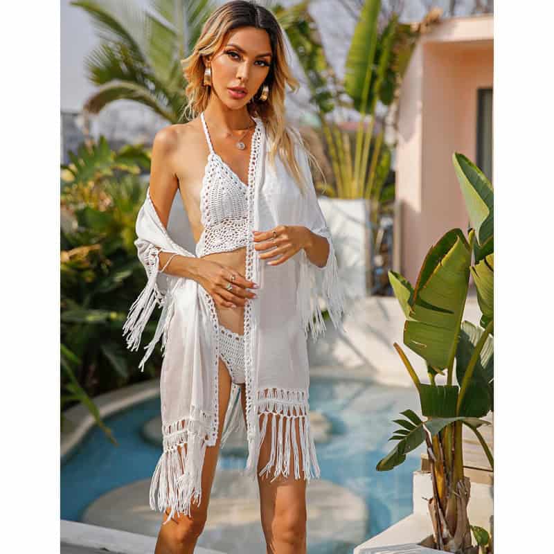 Elegant white crochet beach cover-up perfect for summer vacations and poolside lounging at Monalisa Store. Shop stylish swimwear and accessories for a chic, seaside look.