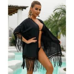 Elegant black fringed beach kimono for women, perfect for poolside or seaside vacations, offering a chic and comfortable coverup option.