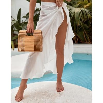 Stylish white beach cover-up with a high slit, perfect for resort and poolside lounging, combining comfort and fashion for a chic summer look.