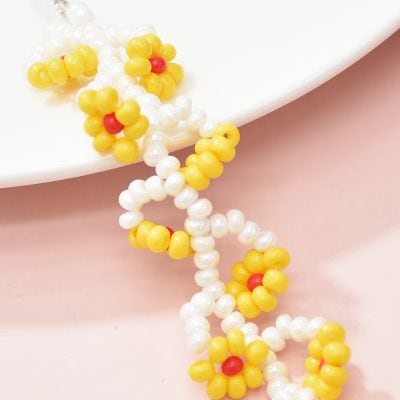 Colorful beaded pearl necklace with yellow, white, and red beads, perfect for fashion accessories and gifting.