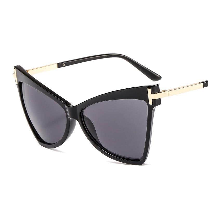 Elegant black designer sunglasses with gold accents, perfect for fashion-forward eyewear lovers. UV protection lenses for stylish sun protection.
