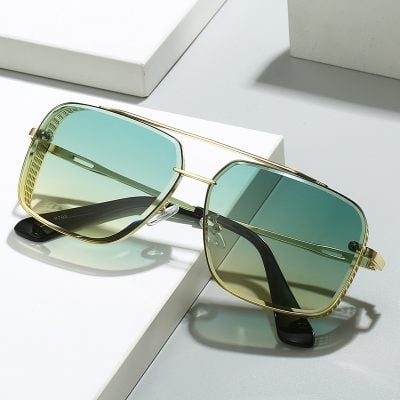 Luxury designer sunglasses with gold frame and gradient tinted lenses for a fashionable eye protection. Perfect for outdoor wear and sun protection.