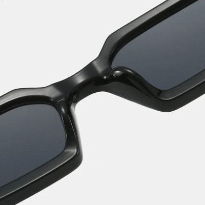 Stylish black sunglasses with dark lenses, perfect for sun protection and modern fashion statements. Ideal for outdoor activities and daily wear.