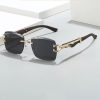Stylish luxury sunglasses with black lenses and gold detailing, featuring a chic design perfect for fashion-forward individuals seeking premium eyewear.