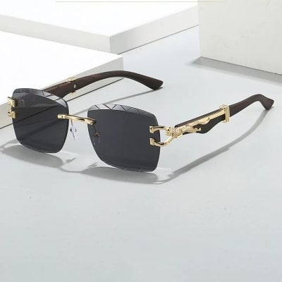 Stylish luxury sunglasses with black lenses and gold detailing, featuring a chic design perfect for fashion-forward individuals seeking premium eyewear.